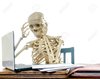 15013098-A-skeleton-getting-a-headache-from-paying-bills-Stock-Photo-computer.jpg